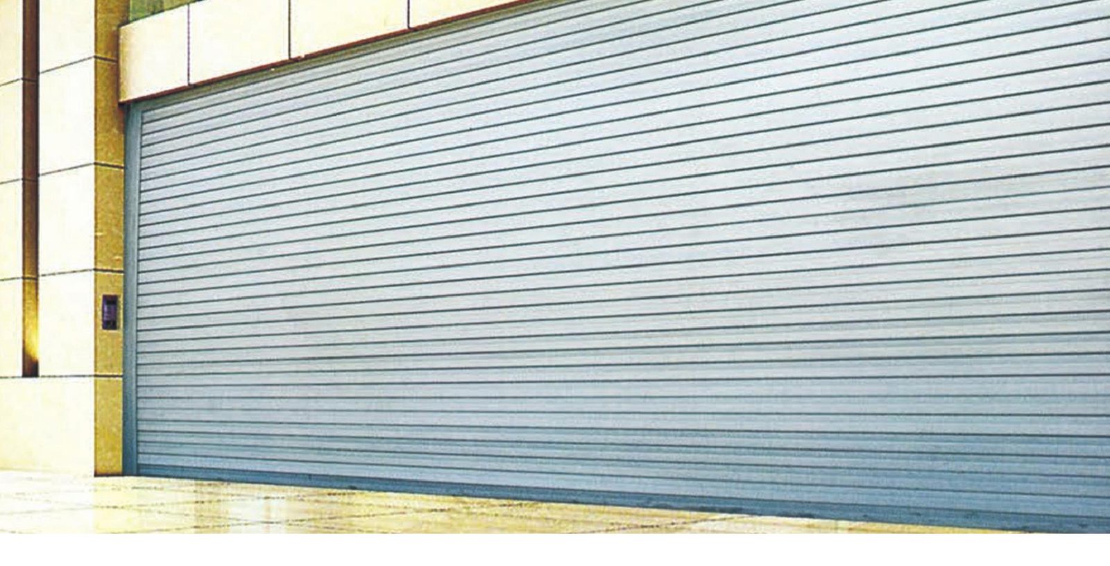 Steel fireproof rolling shutter door on a commercial building